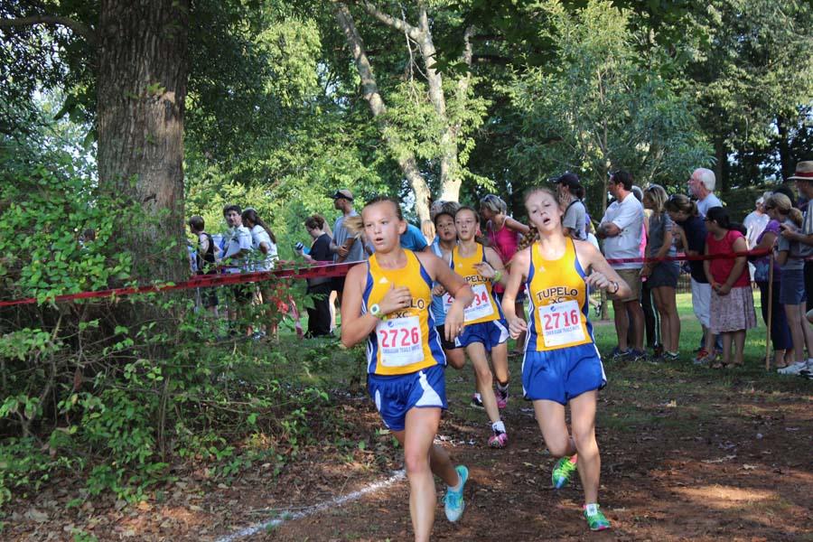 Jenna Jolly and Niland Fortenberry race in the Chickasaw Invitational Cross Country Meet in Moulton Alabama.
