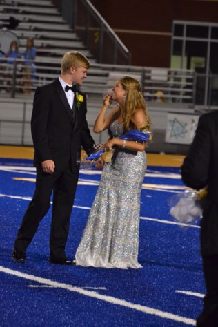 Neely Brown reacts as she is named Tupelo High School's Homecoming Queen on Sept. 26, 2014. Her escort is Carson Roberts.
