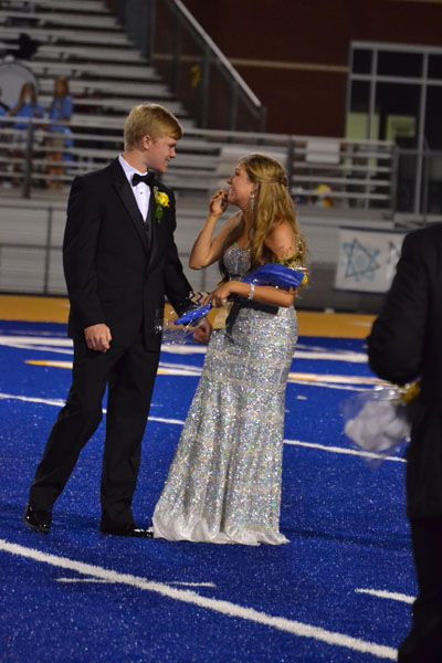 Neely Brown reacts as she is named Tupelo High Schools Homecoming Queen on Sept. 26, 2014. Her escort is Carson Roberts.