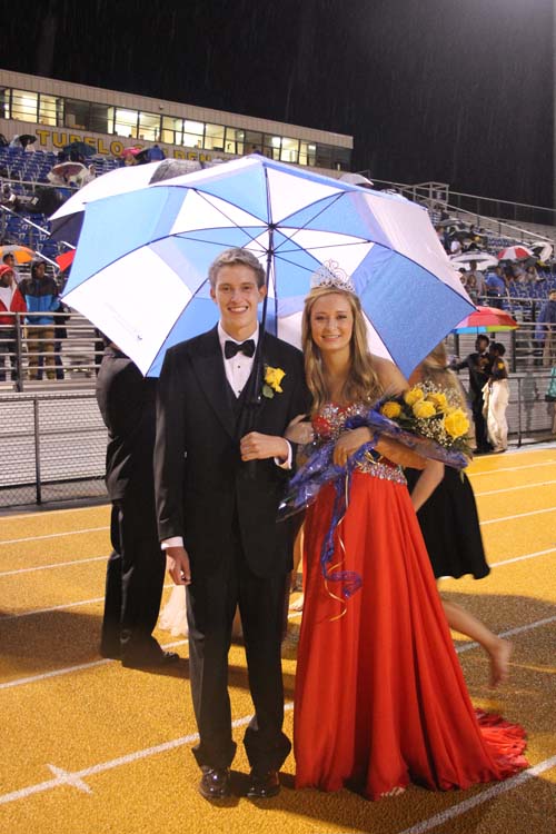 Queen Walker Fortenberry and her escort, Will Herrington, smile after being crowned.