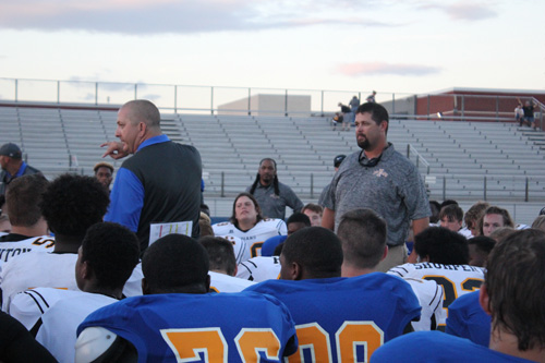 Coach Hammond gives a speech to all the players.