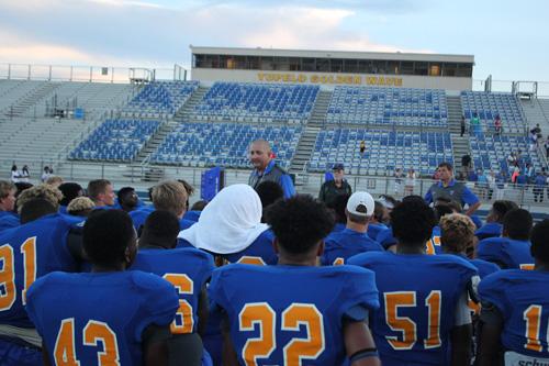 Coach Hammond gives a speech to all the players.