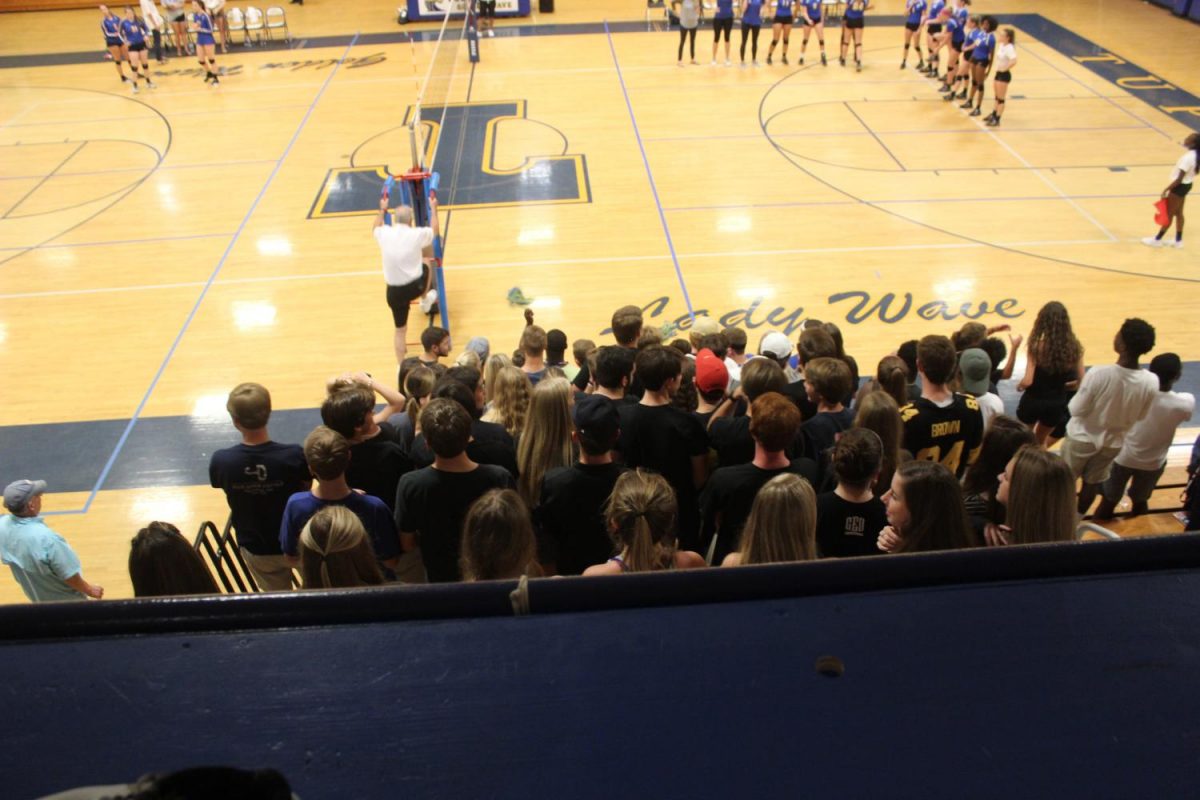 Black Out! The student sections came out to support their Lady Wave. 