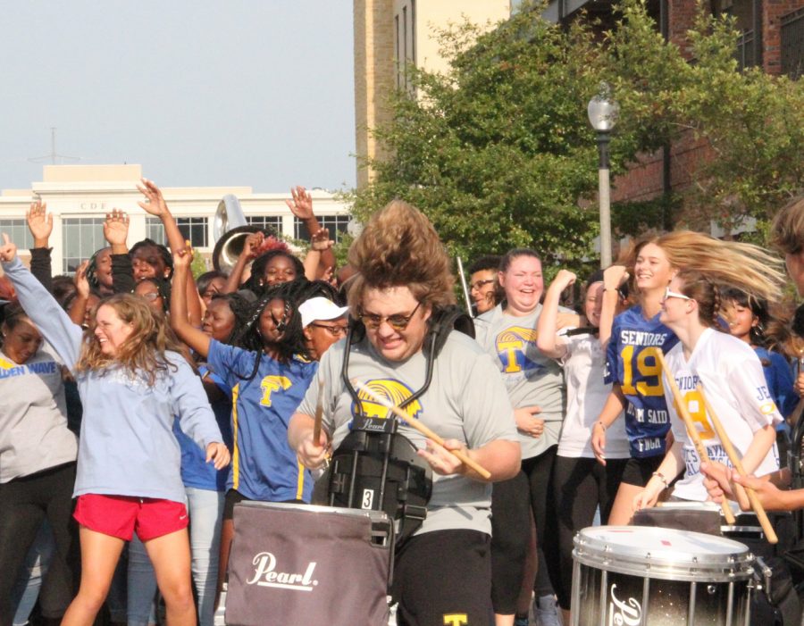 Snare drummer Stephen Lake plays out to get the crowd excited for the first home football game