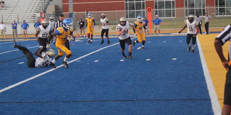 Wide Receiver Jordan Buchanan rushes for the end zone.  