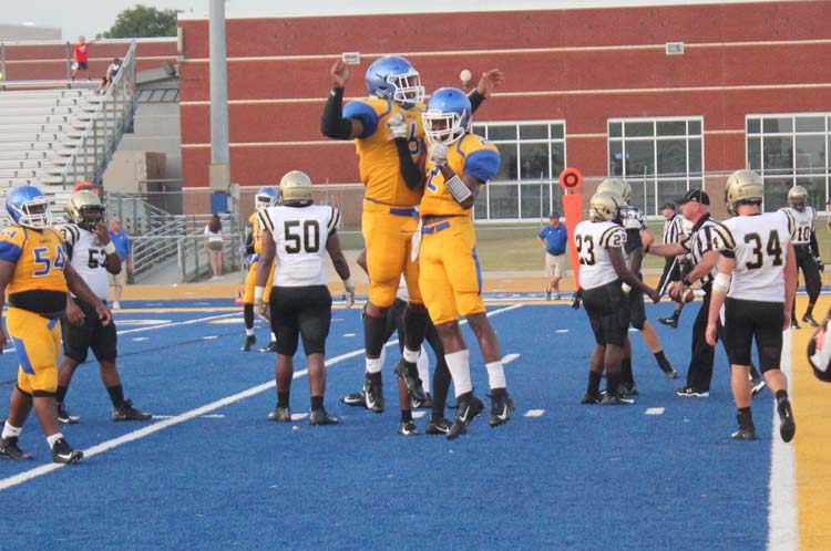 Chest-bumping is a tradition with the Tupelo Football team. 