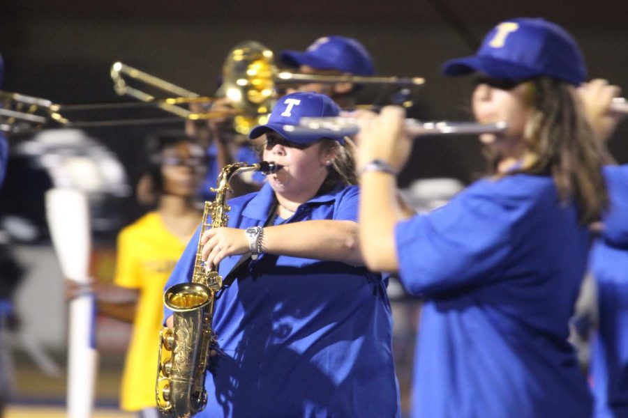 Kaitlyn Haire, 12, saxophone player marching during halftime.