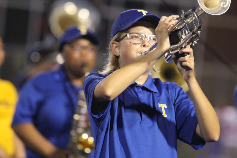 Bryce Heatherly, 10, marching trumpet during the THS bands halftime performance