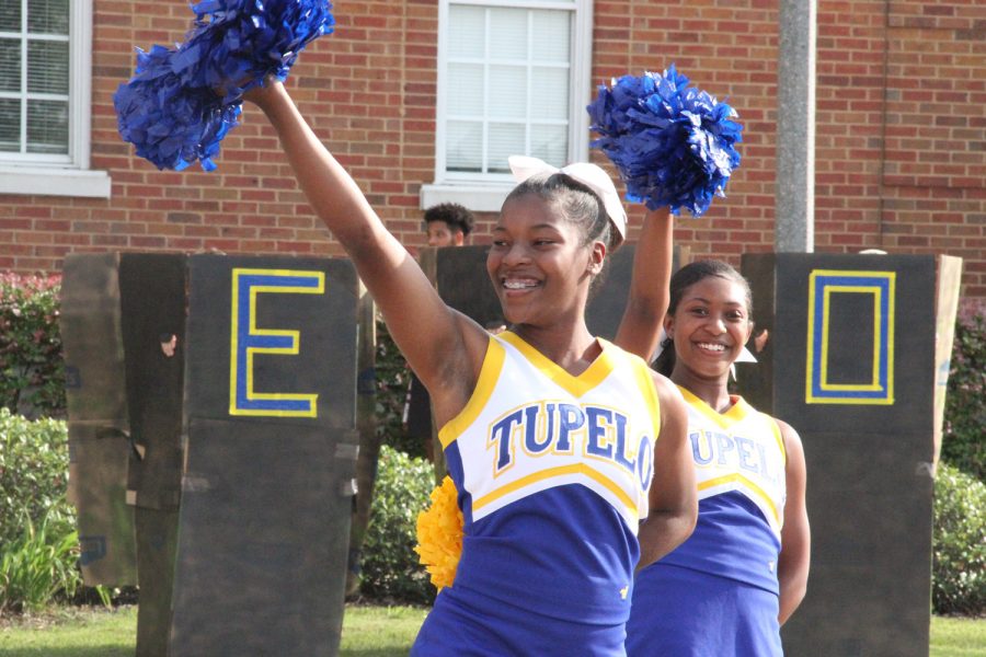 THS Cheerleaders smiling and showing pride for their football team