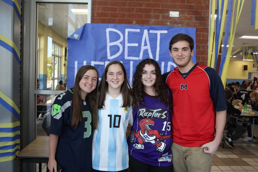 Alex Hodge, Anna Hunter, Sidney Bigham, and Mark Holland posing for jersey day