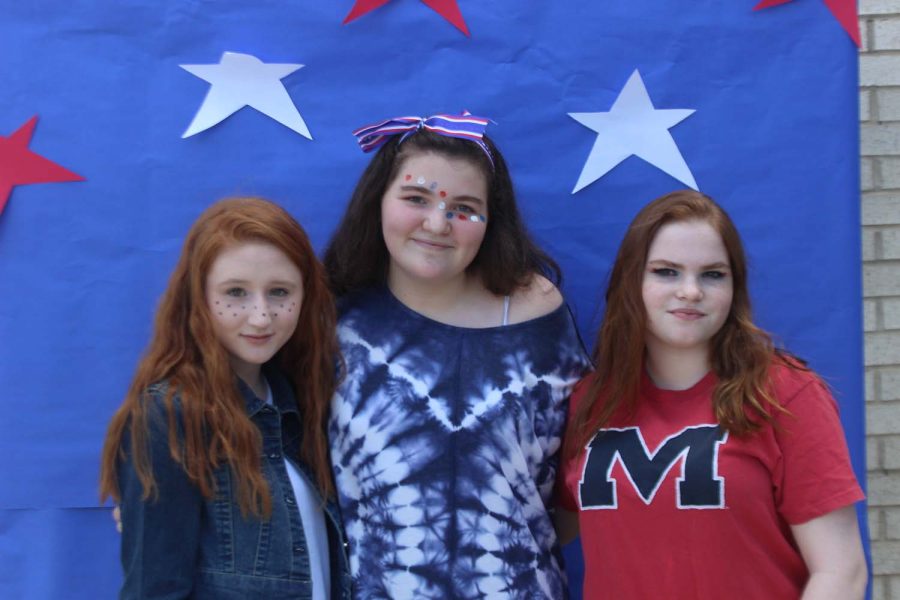 Freshmen, Madison James, Sarah Buzzell, and Kaylae Watson posing for America day