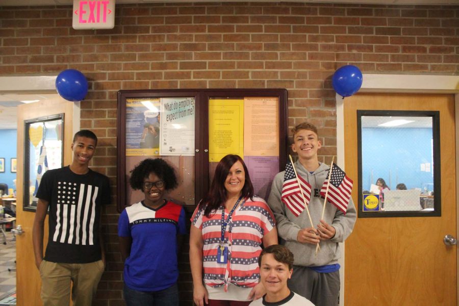 THS students posing with their teacher for america day