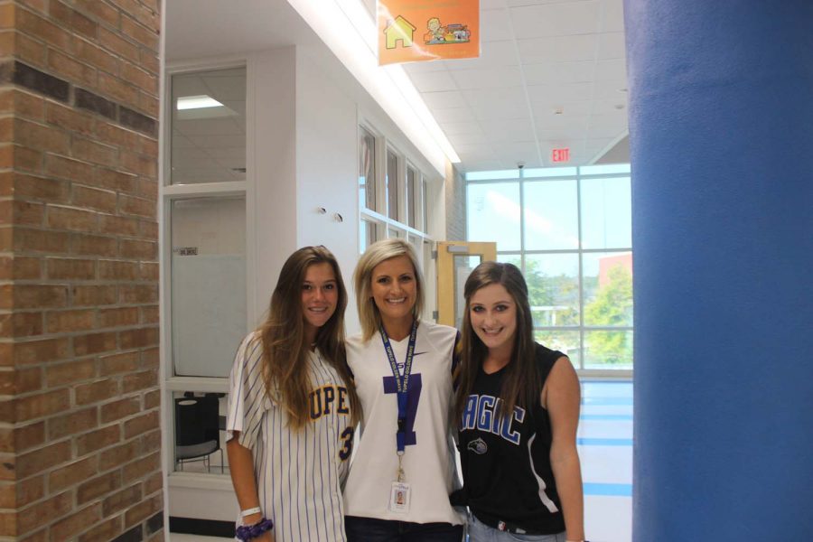 THS students posing with their teacher for jersey day