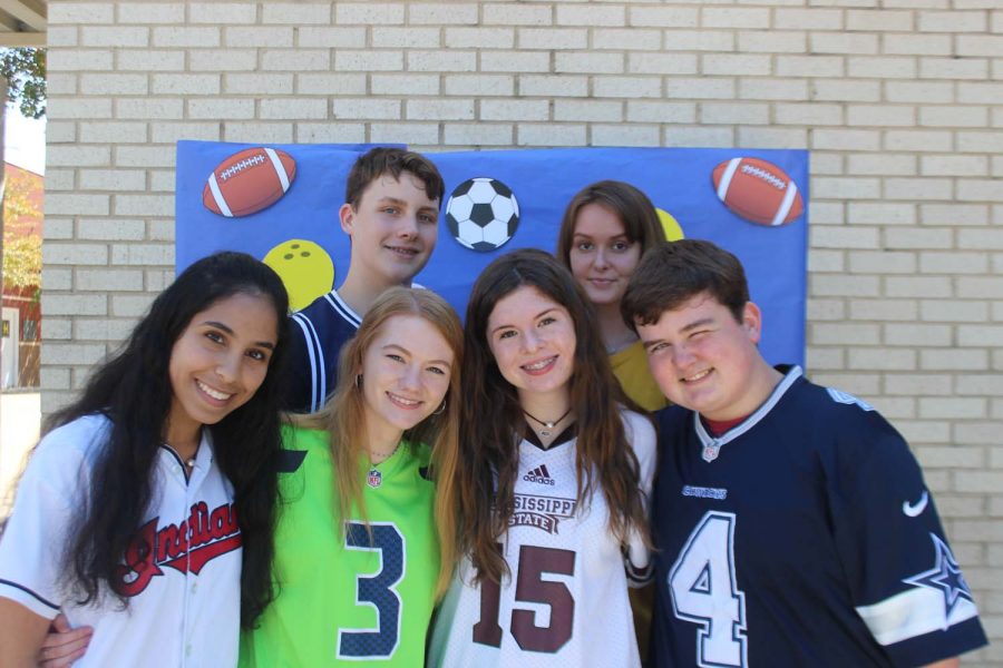 Sophomores Khaoula Kamal and Kiersten Tullos and freshmen: Kelly Coggin, Alan Thorderson, Brody Grayson, and Aleena Komarec posing on Jersey day