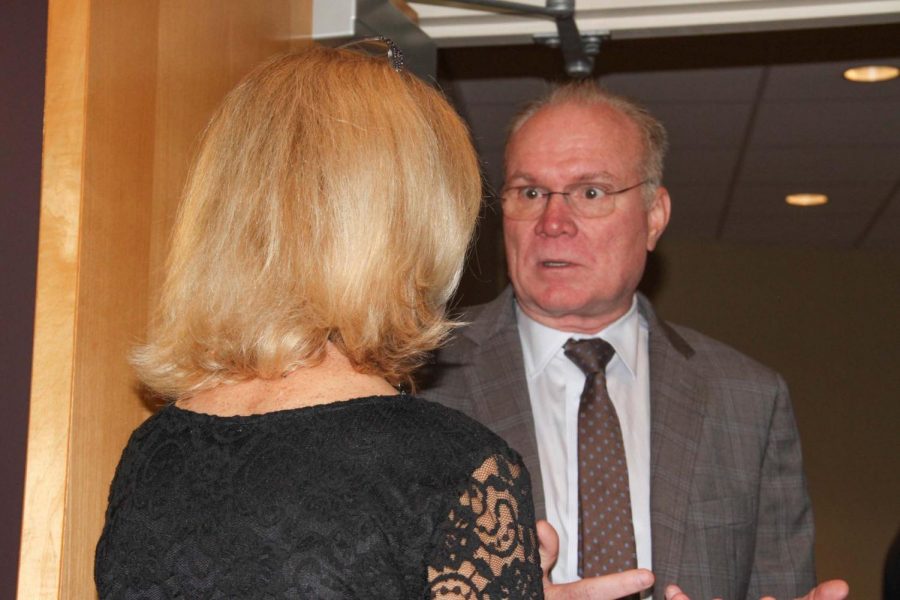 Dr. Rob Picou speaks with Dr. Suzy Williams following the Veterans Program reception.