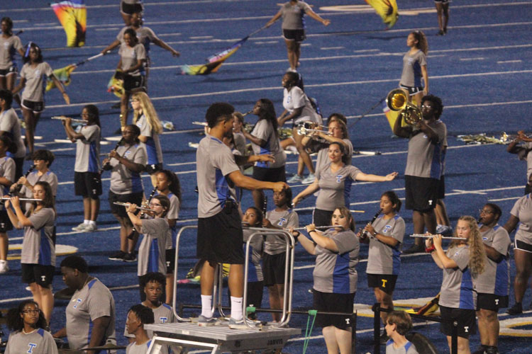 Marcus Davis, Drum Major, 12, directs the band as they start the halftime show 