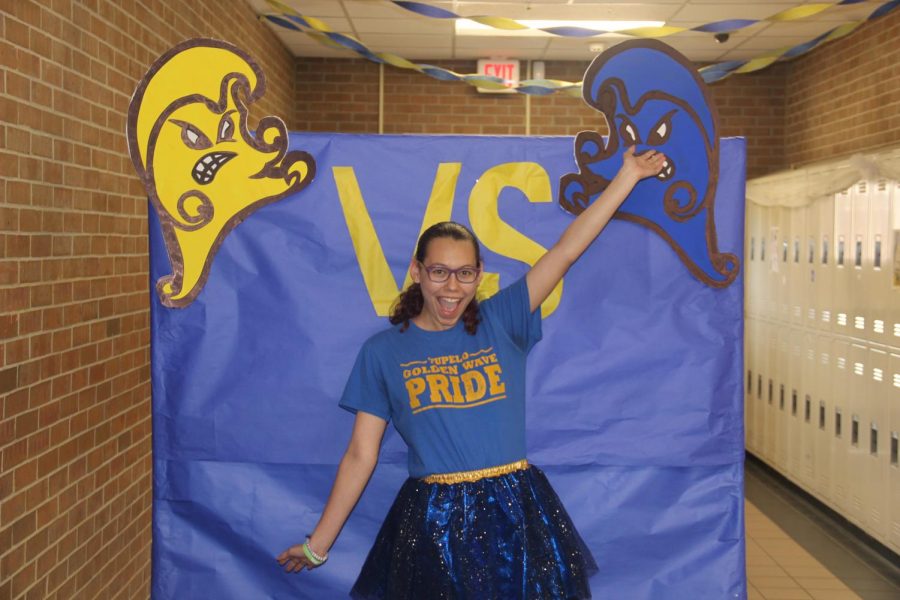 Alexis Moscato competes with Goldie and the Waveman to see who has more blue and gold spirit. 