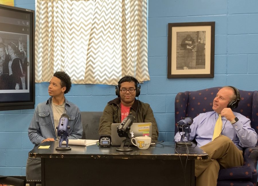 Tupelo High School Principal Art Dobbs discusses photos from his high school yearbooks with the Tupelo Tea hosts, Rahul Day and Thomas McGaughy