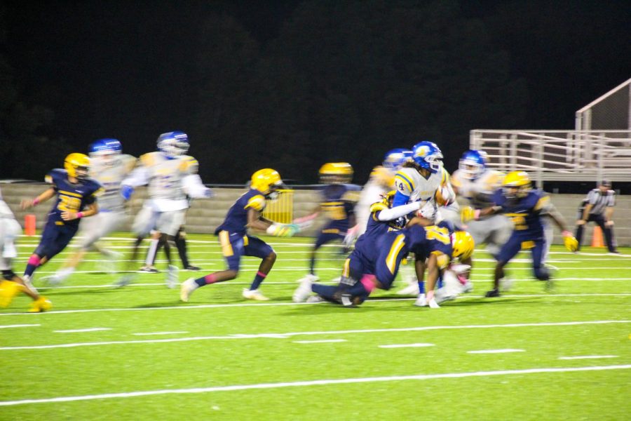 Kyson Brown attempts to avoid a tackle.