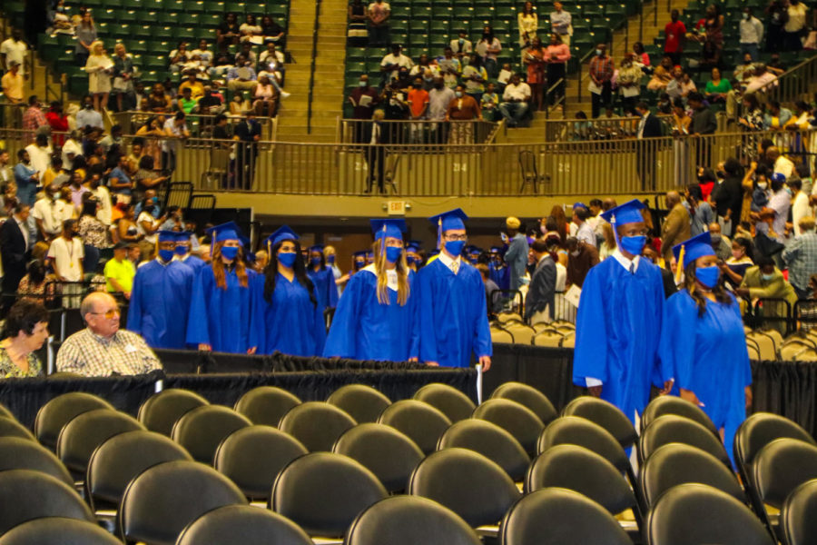 Tupelo High School Class of 2021 Graduation at BancorpSouth Arena, May 21, 2021.  Graduates process in to the traditional Pomp and Circumstances played by the THS Band and Golden Wave Orchestra.  