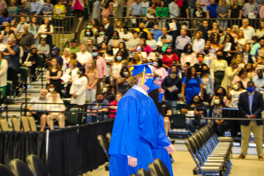 Tupelo High School Class of 2021 Graduation at BancorpSouth Arena, May 21, 2021.  Graduates process in to the traditional Pomp and Circumstances played by the THS Band and Golden Wave Orchestra.  