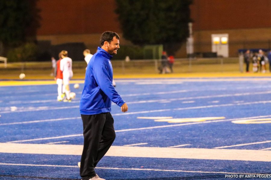 Tupelo soccer Coach Faucette has a bright moment on the sidlelines.