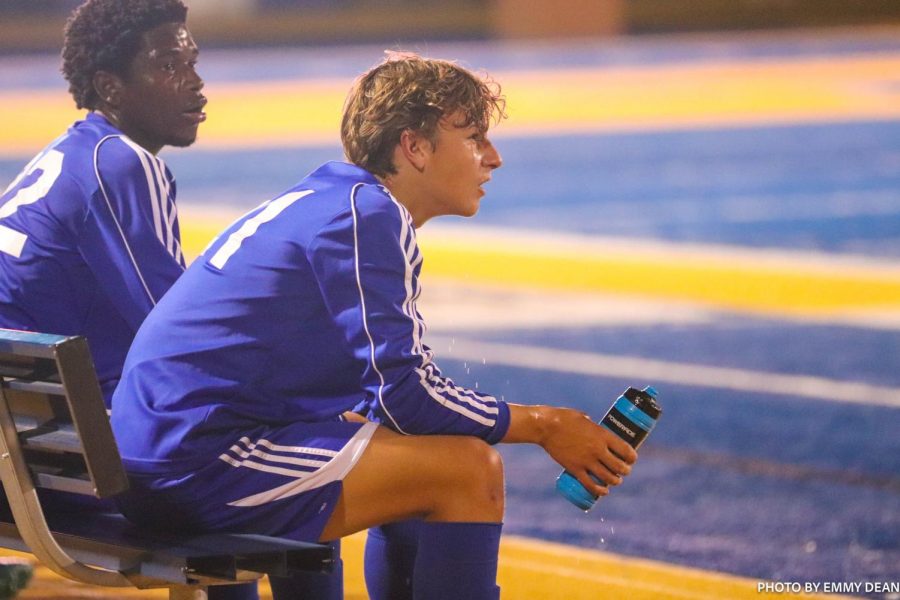 Player awaits on the bench as the rest of his team continues to win against New Hope. 