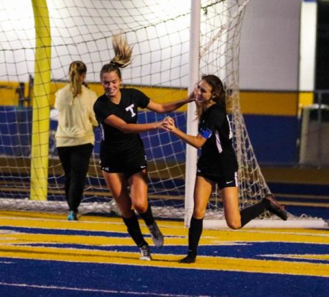 Avery Hooker and Evie Crawford celebrate a goal during the game v. Hernando on November 9. 