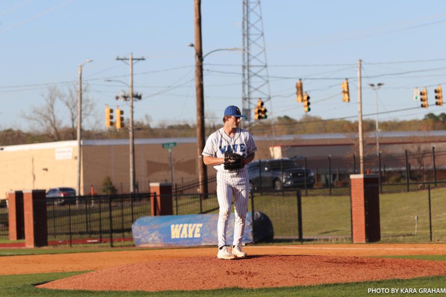Parker Brown (16) prepares to pitch against the Grenada JV team.