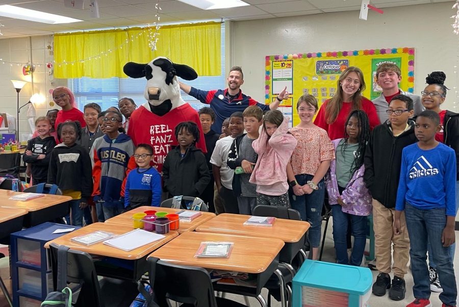 Chick-fil-a at Barnes Crossing owner Taylor Locke and the Chick-fil-a cow visit third graders at Pierce Street Elementary. 