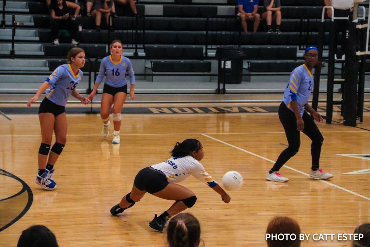 Miracle Hereford passes the ball. 