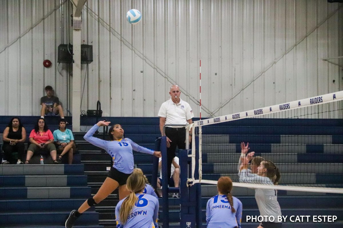 Kennedi Simmons gets ready to smack the ball over the net to Jackson Academy. 