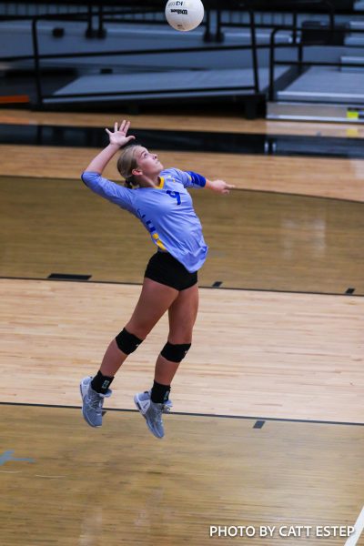 Mamie Shettles jump serves to get the ball going. 