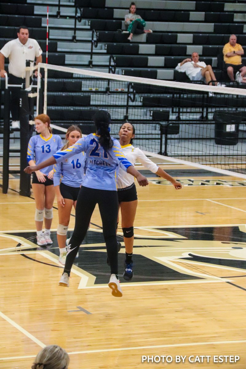 Miracle Hereford and Arranda Mitchell do their ritual bump before every game. 