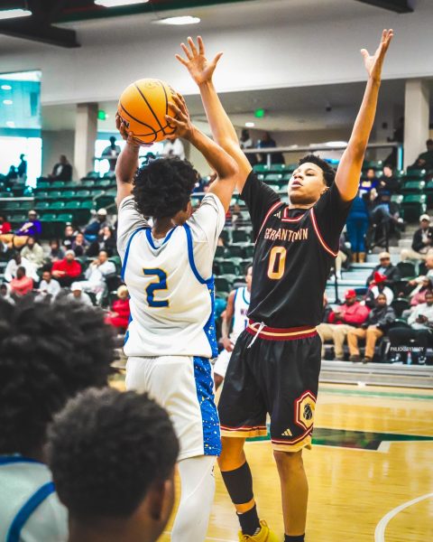 Jeremiah McGlaun shoots against a german town defender. 