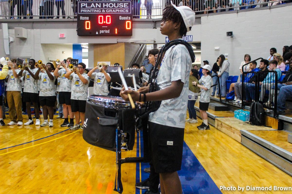 Tupelo Percussionist drumming away at the pep rally.