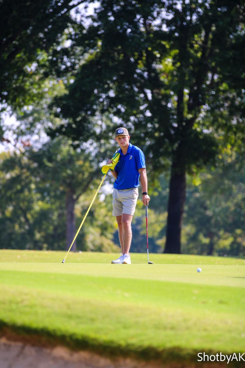 Sam Ueltschey determining the best approach for this difficult shot.