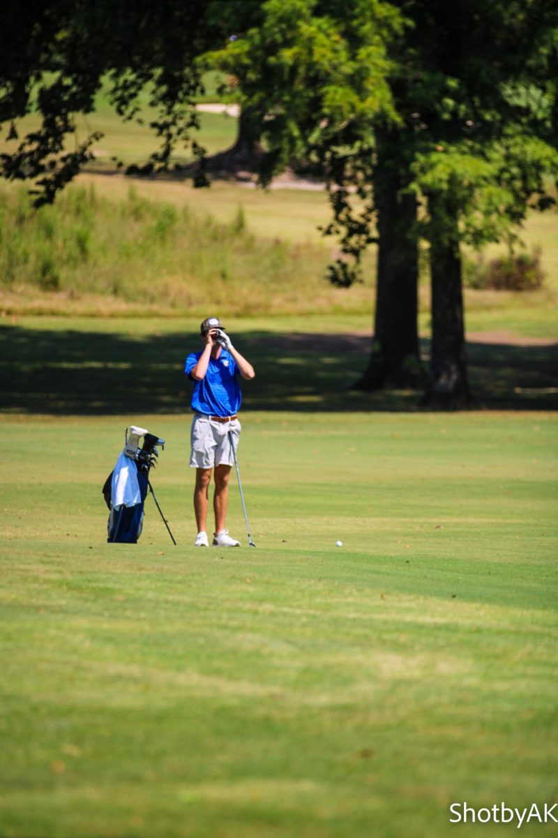 Winders sets up for his next shot using his rangefinder.