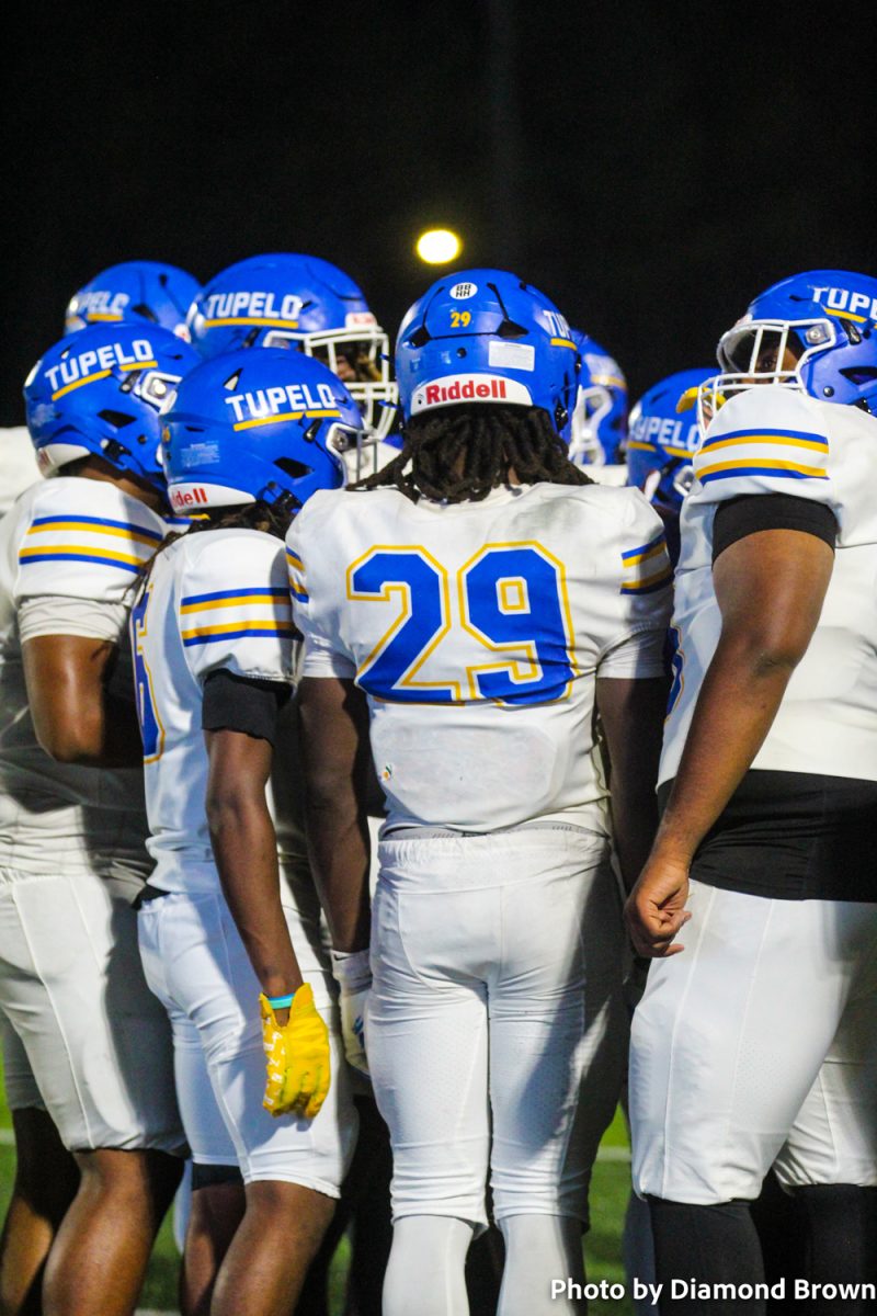Team in a huddle to make adjustments 