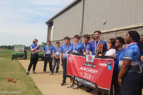 Archery team with their first place medals